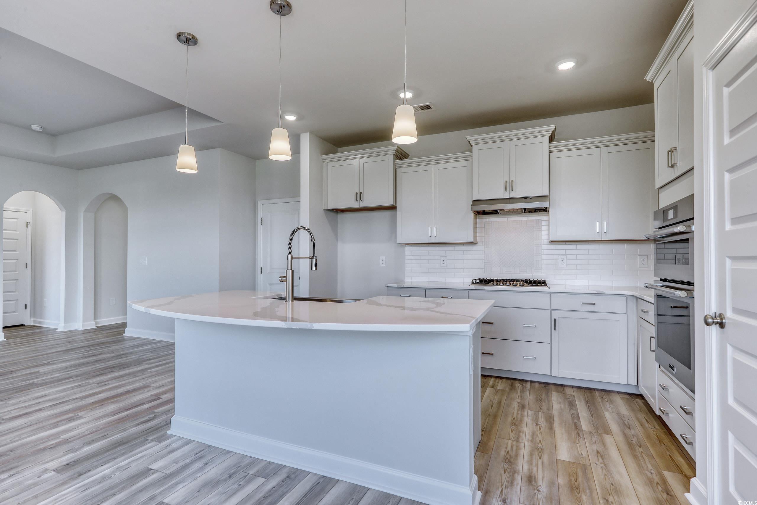 771 Enchantment Loop Myrtle Beach, SC 29588 - Photo 6 of 40 Kitchen with light hardwood / wood-style floors, p
