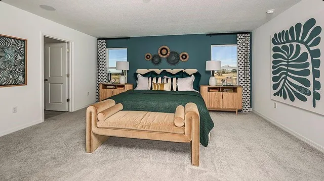 a bedroom with a bed and a table