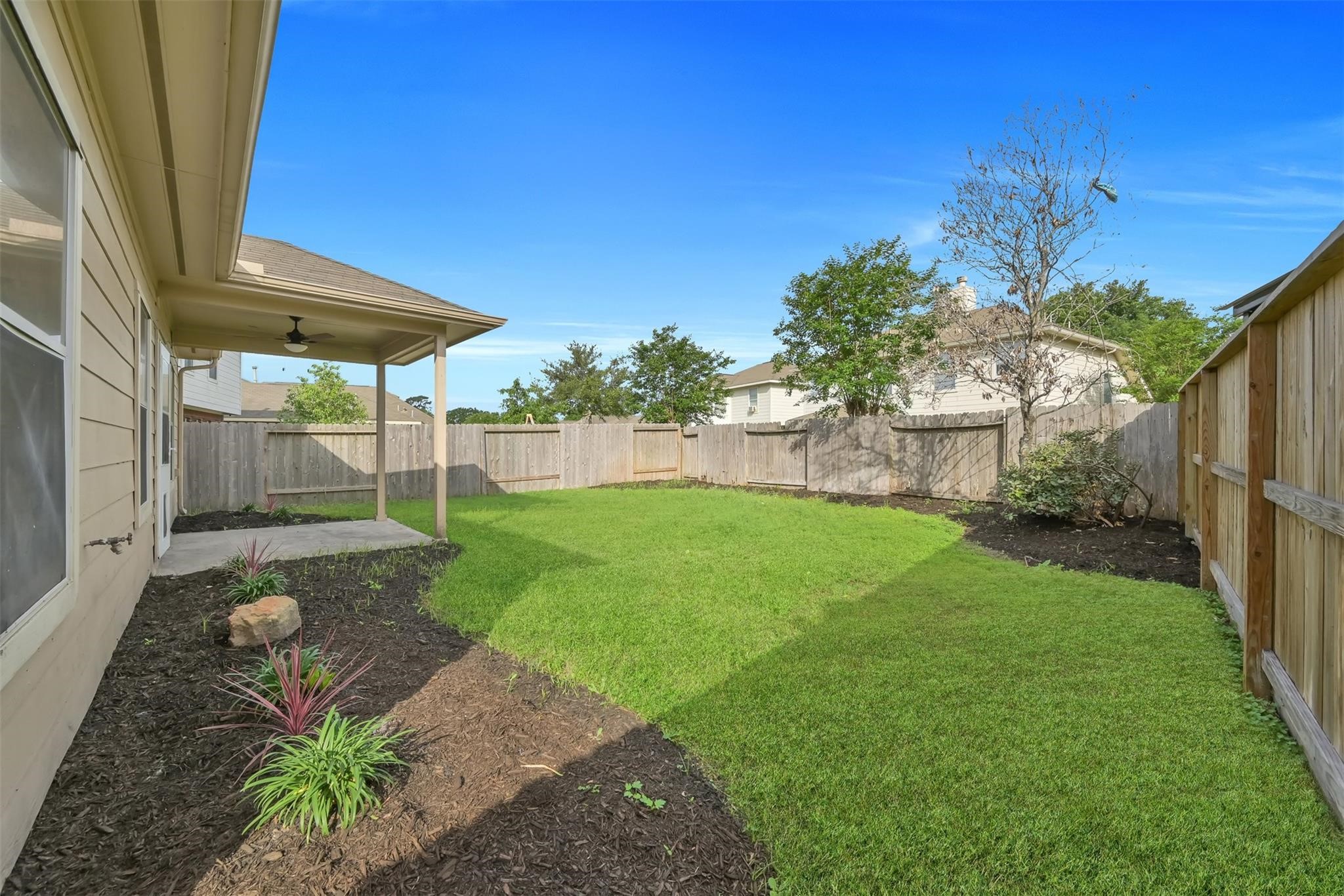 1443 Meadowhigh Lane Spring, TX 77373 - Photo 22 of 23 a view of a backyard with a garden