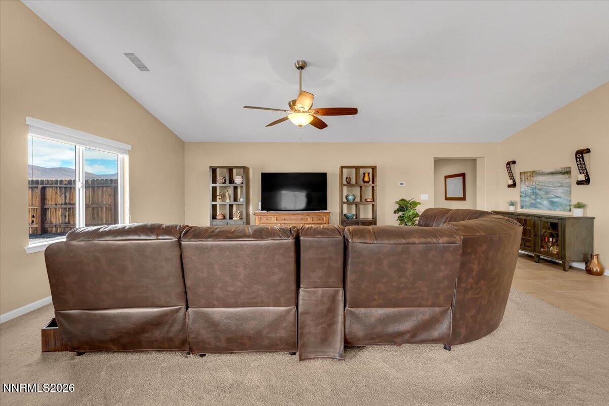 104 Bethpage Road Dayton, NV 89403 - Photo 15 of 65 a living room with furniture a ceiling fan and a window