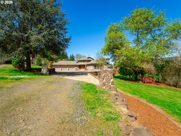 a view of a park with large trees