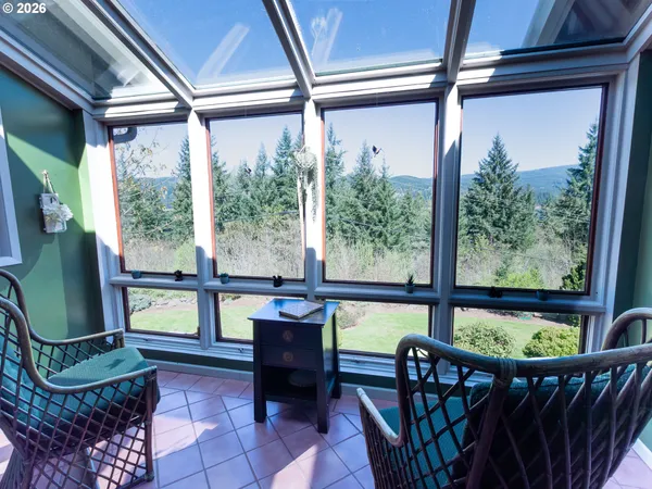 a view of a porch with furniture and a window