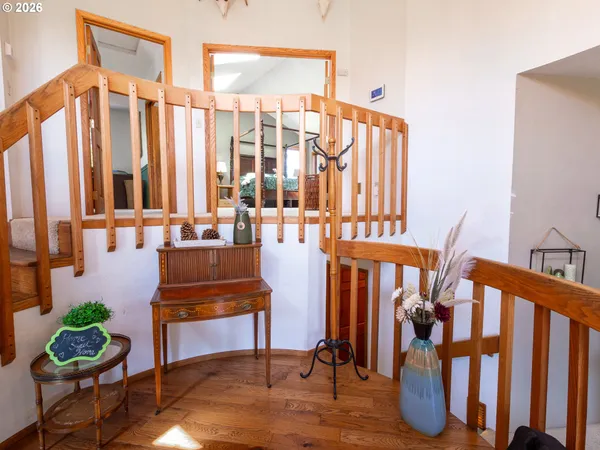 a living room with furniture and a potted plants