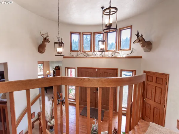 a view of a windows and wooden floor in a room