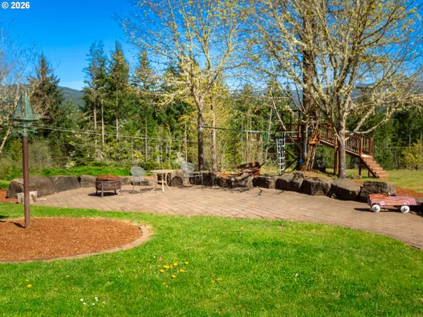 a swimming pool with outdoor seating and yard