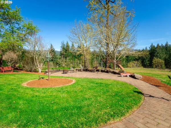 a view of a playground with basketball court