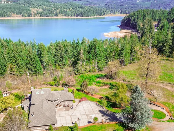 a backyard of a house with yard and outdoor seating