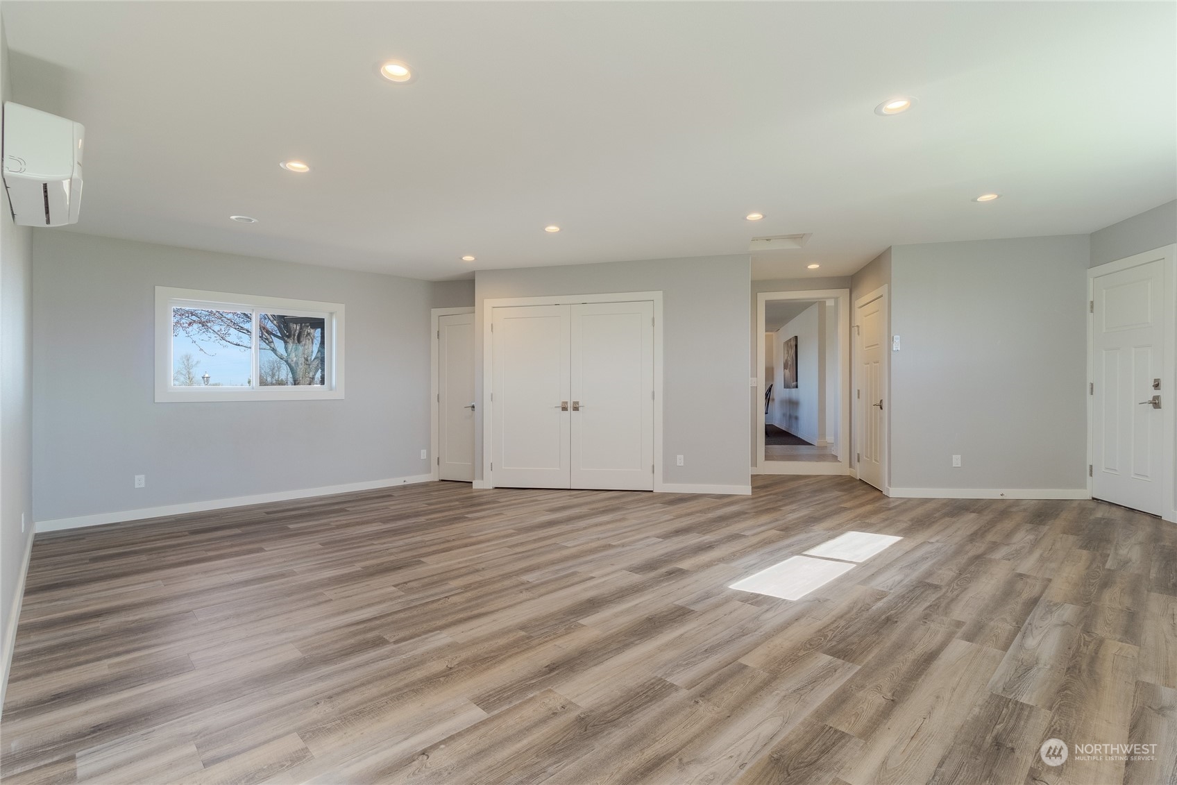1479 Spring Branch Road Walla Walla, WA 99362 - Photo 25 of 40 a view of an empty room with wooden floor and a window