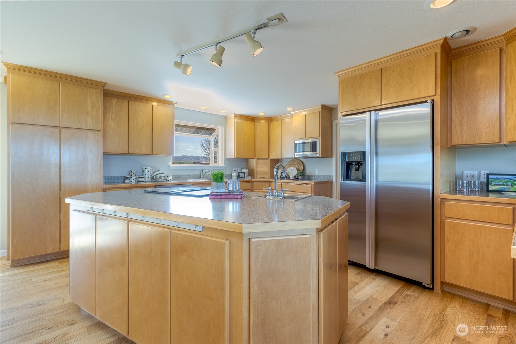 1479 Spring Branch Road Walla Walla, WA 99362 - Photo 7 of 40 a kitchen with stainless steel appliances granite countertop a refrigerator a sink and a stove
