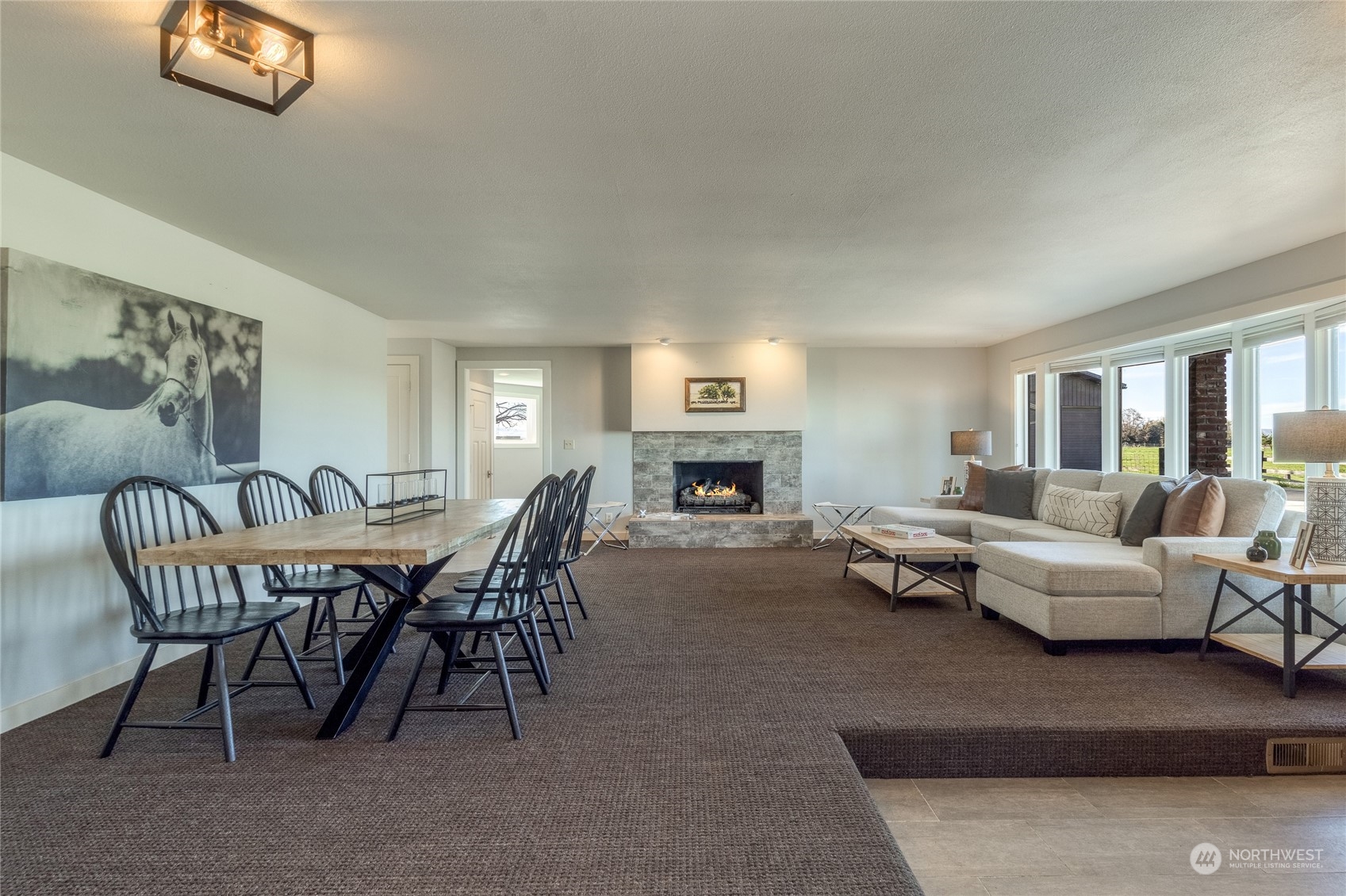 1479 Spring Branch Road Walla Walla, WA 99362 - Photo 10 of 40 a living room with furniture a fireplace and a table