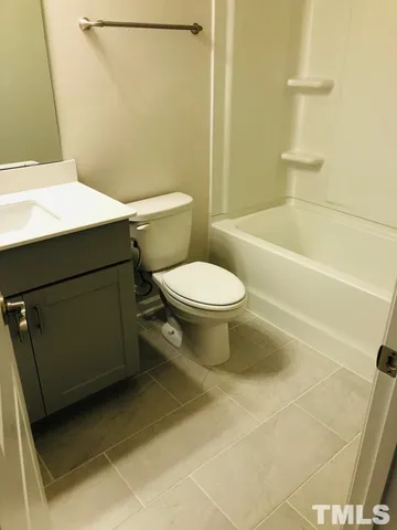 a view of a brick house with large windows