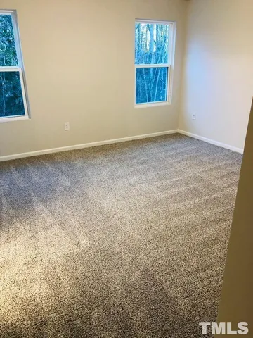 a bathroom with a shower sink and mirror