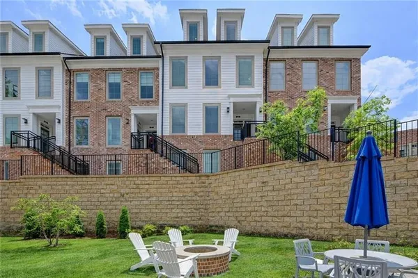 a aerial view of a house with a backyard
