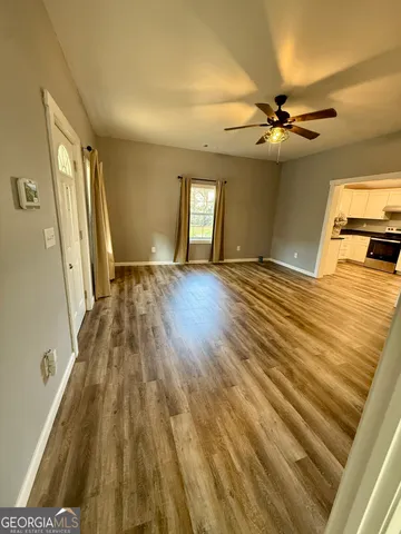 a bedroom with a bed and glass walk in closet