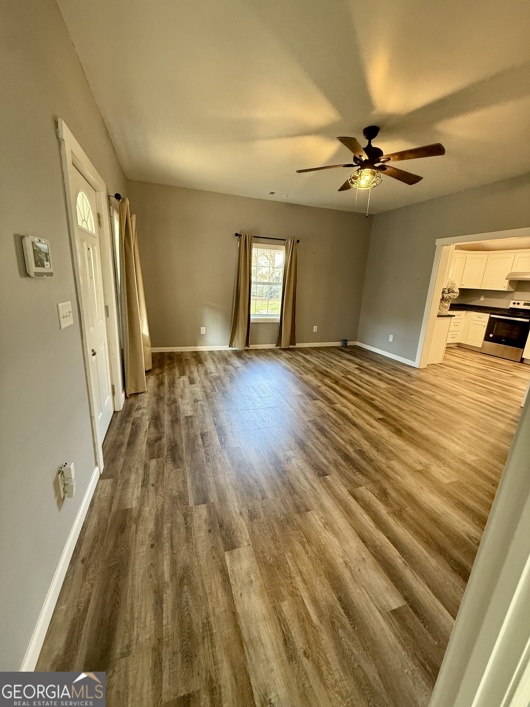 41 6th Street Trion, GA 30753 - Photo 12 of 60 a view of an empty room with window and wooden floor