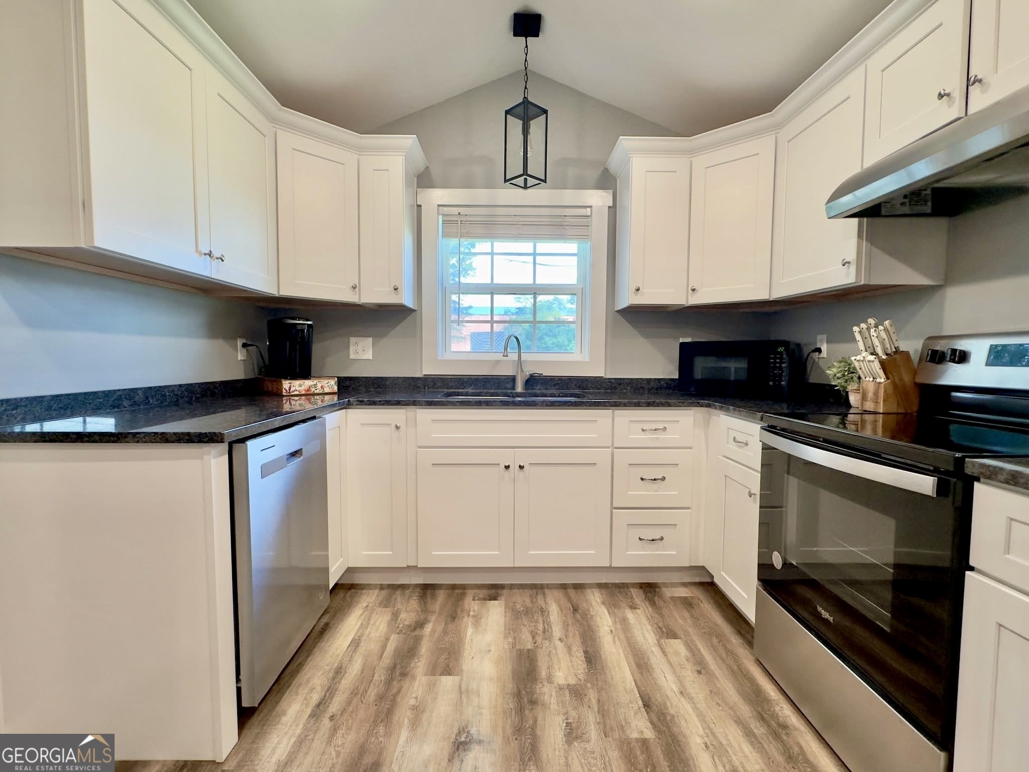 41 6th Street Trion, GA 30753 - Photo 18 of 60 a kitchen with granite countertop white cabinets stainless steel appliances and a window