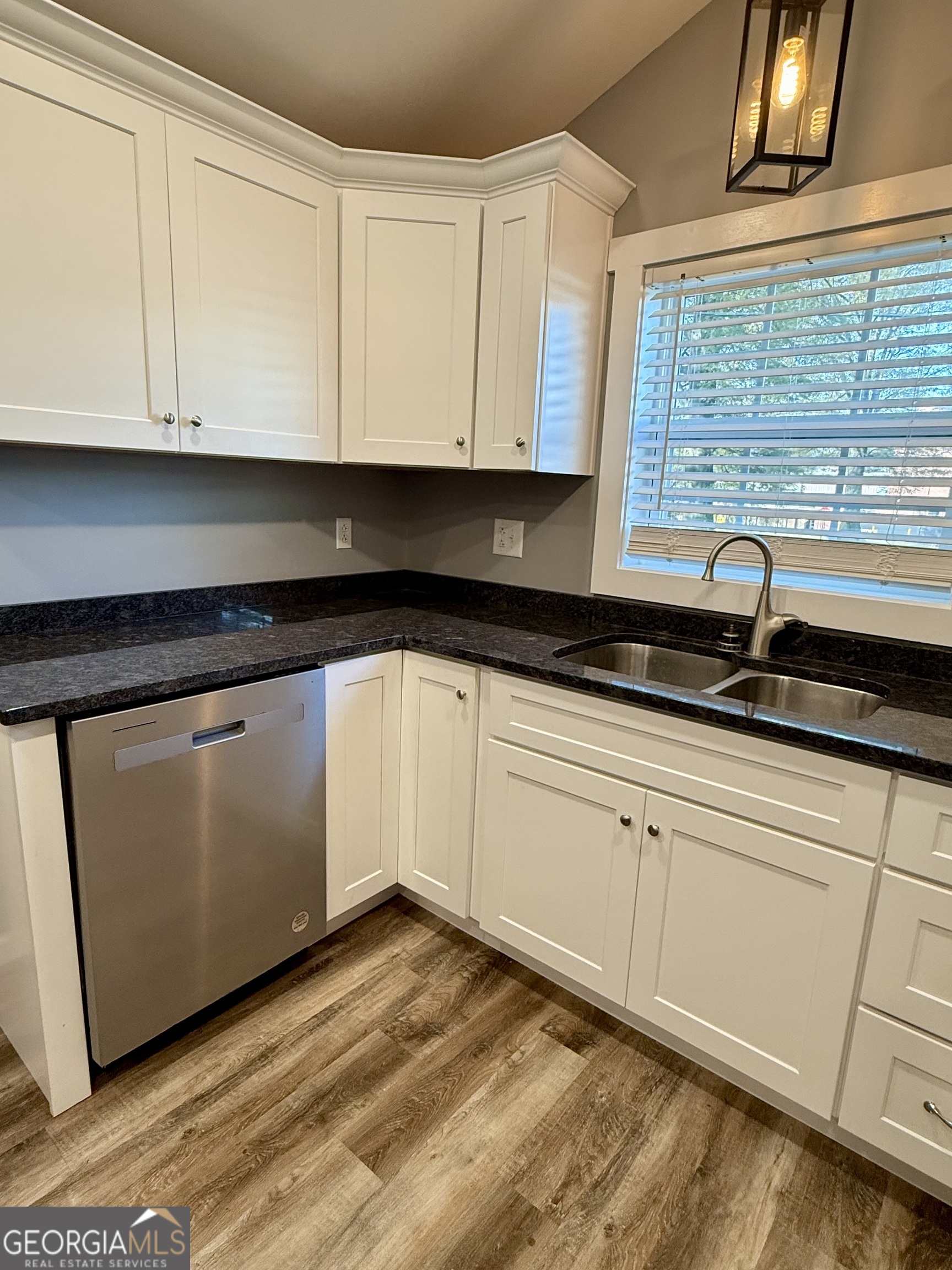 41 6th Street Trion, GA 30753 - Photo 19 of 60 a kitchen with granite countertop white cabinets and white appliances