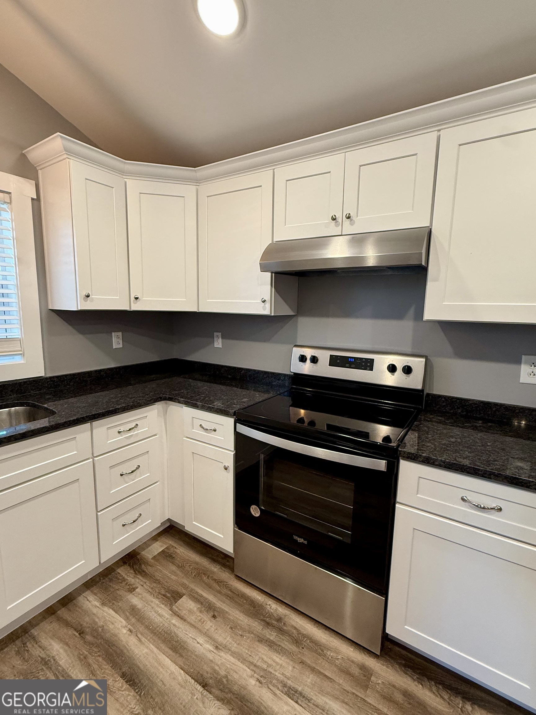 41 6th Street Trion, GA 30753 - Photo 23 of 60 a kitchen with granite countertop white cabinets and appliances