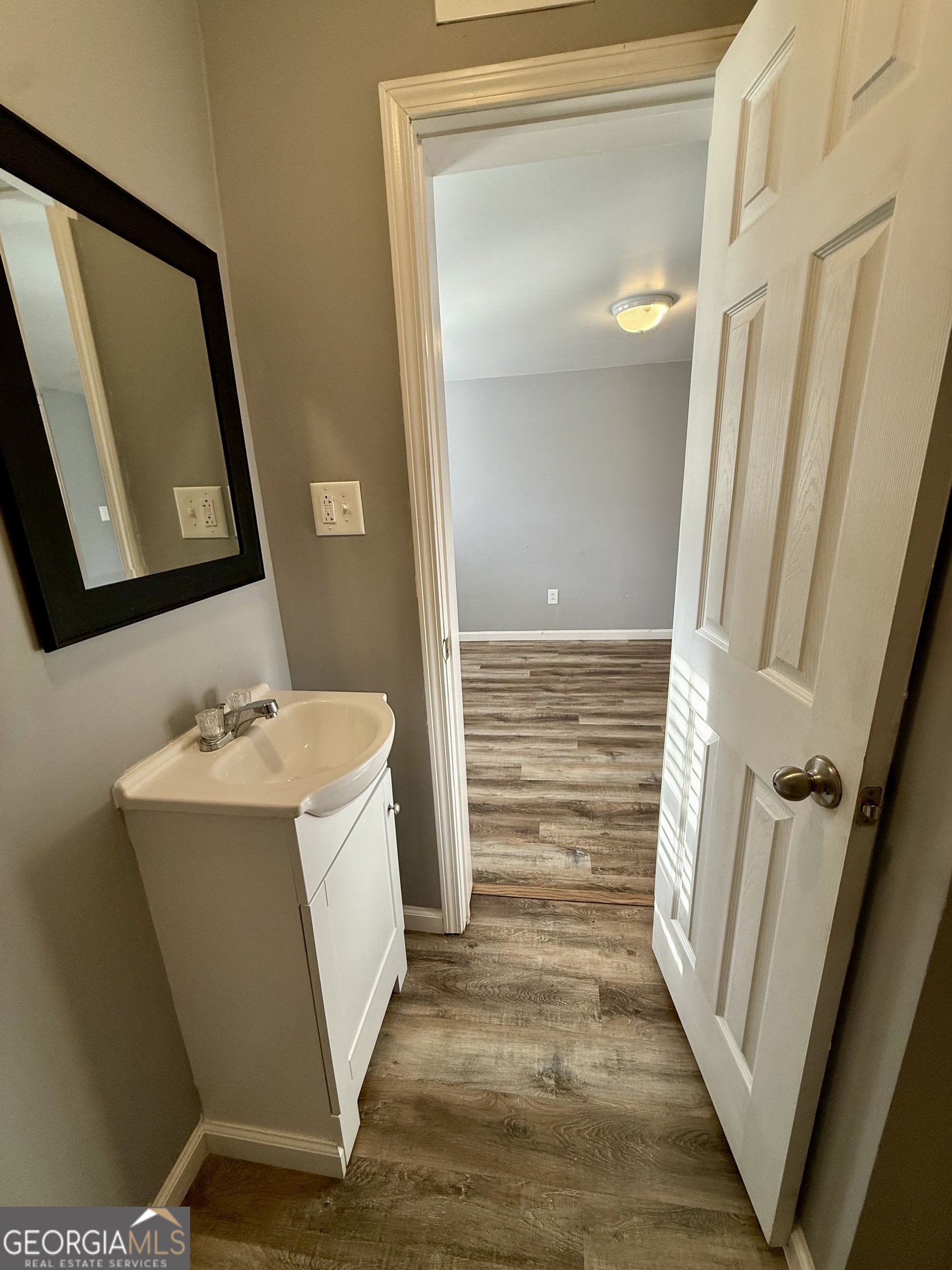 41 6th Street Trion, GA 30753 - Photo 39 of 60 a bathroom with a sink a toilet and a mirror
