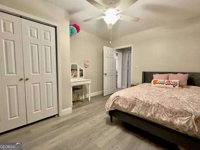 a view of a house with pool and sitting area
