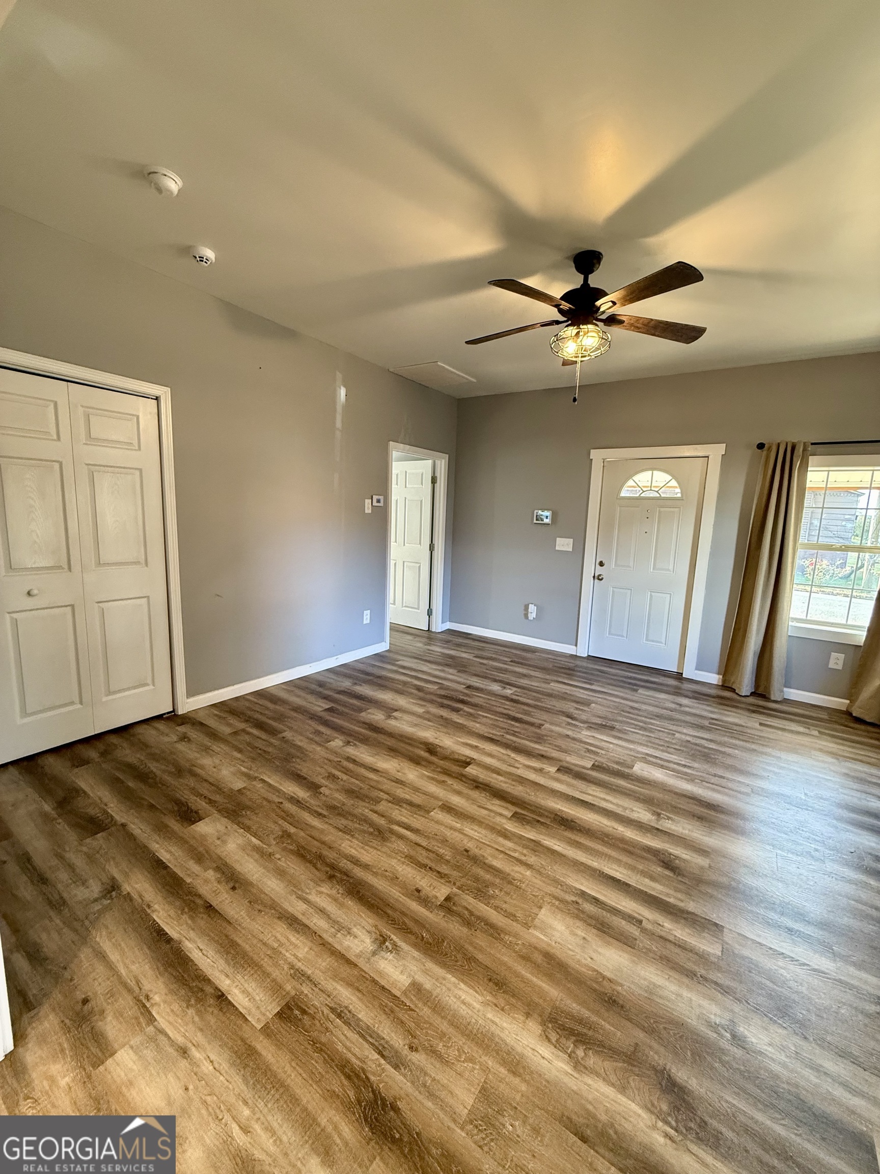 41 6th Street Trion, GA 30753 - Photo 8 of 60 a view of a livingroom with a chandelier fan and wooden floor