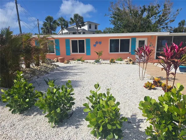 a front view of a house with yard