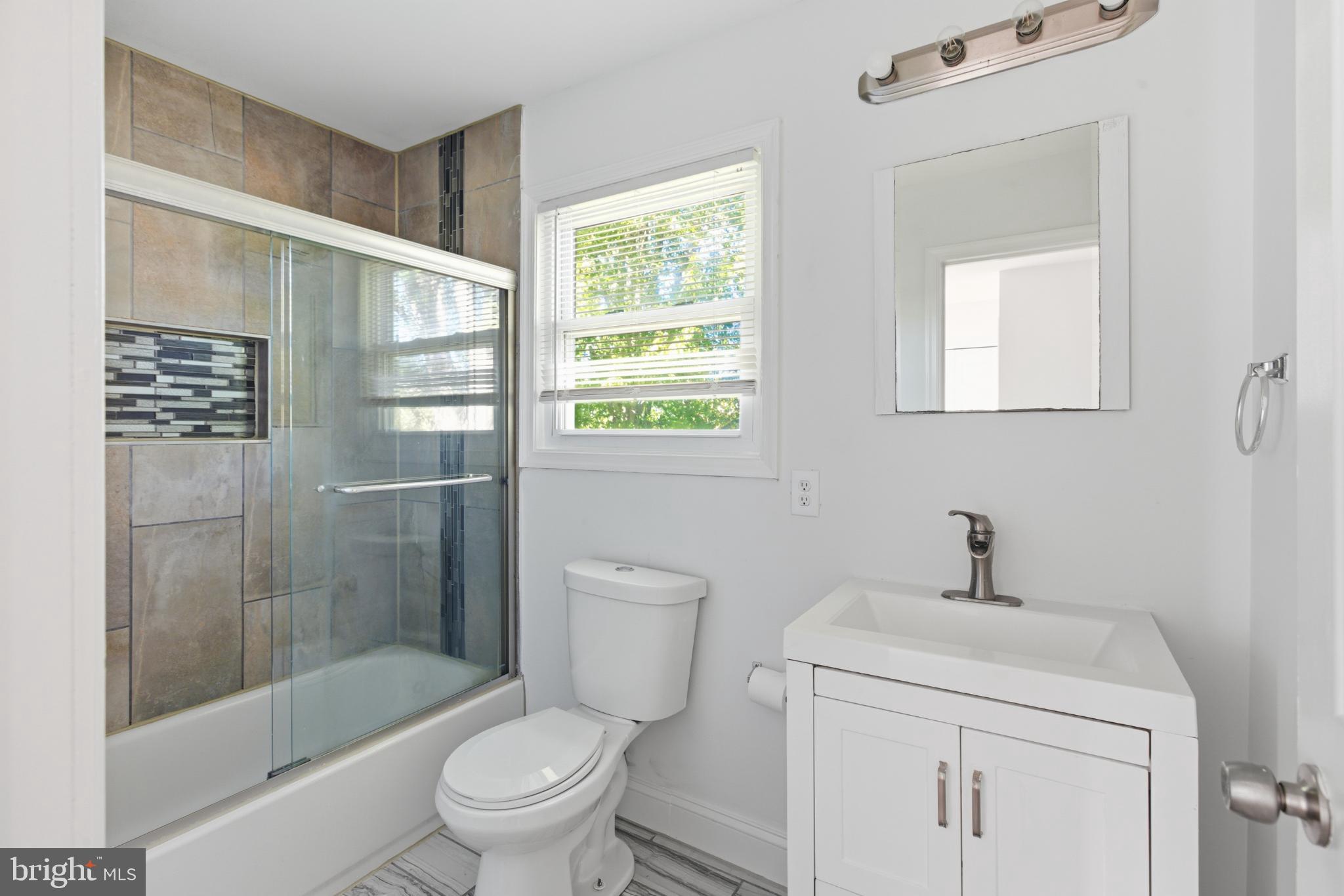 1826 Hanson Road Edgewood, MD 21040 - Photo 13 of 22 a bathroom with a sink a toilet and shower