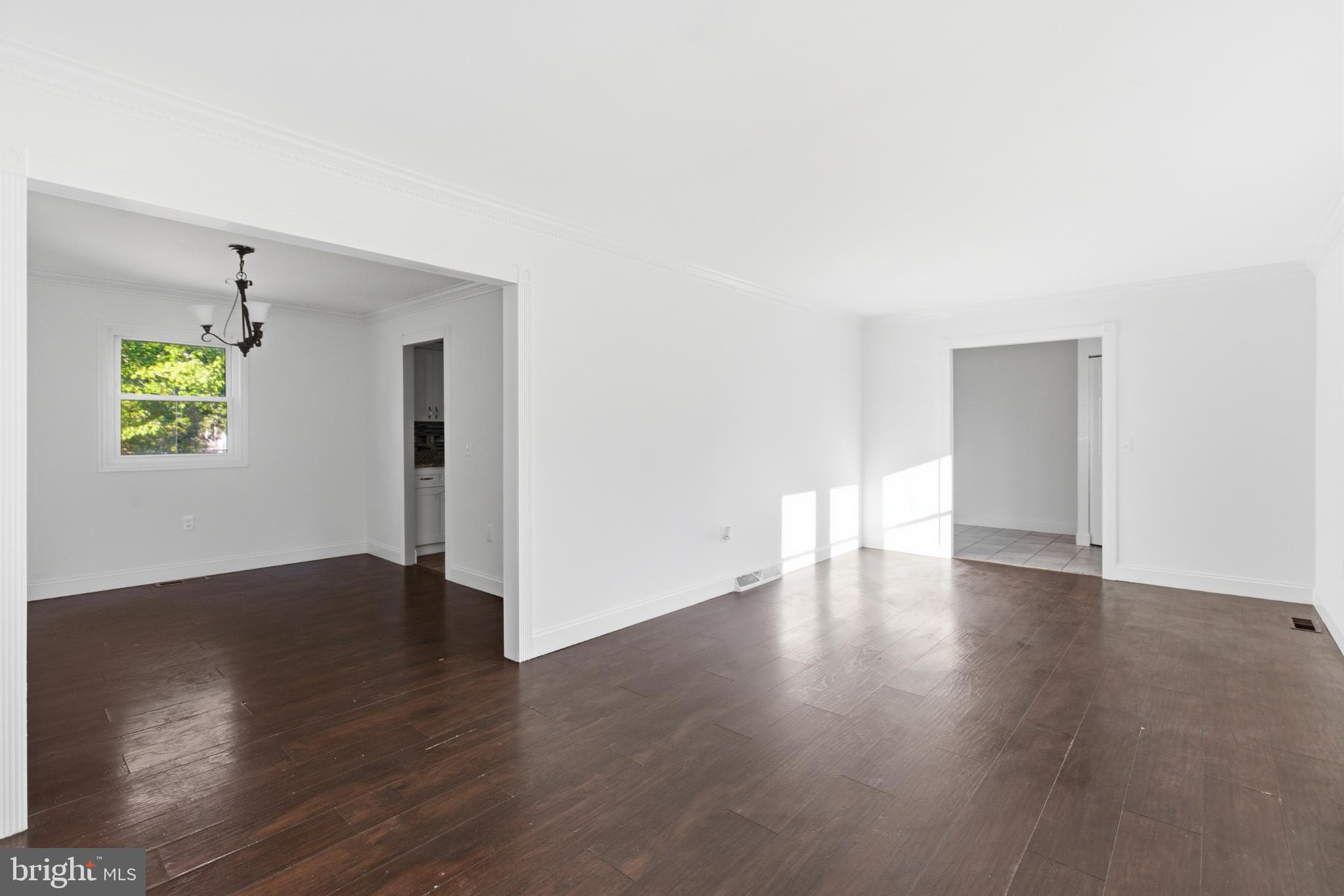 1826 Hanson Road Edgewood, MD 21040 - Photo 3 of 22 a view of an empty room with wooden floor and window