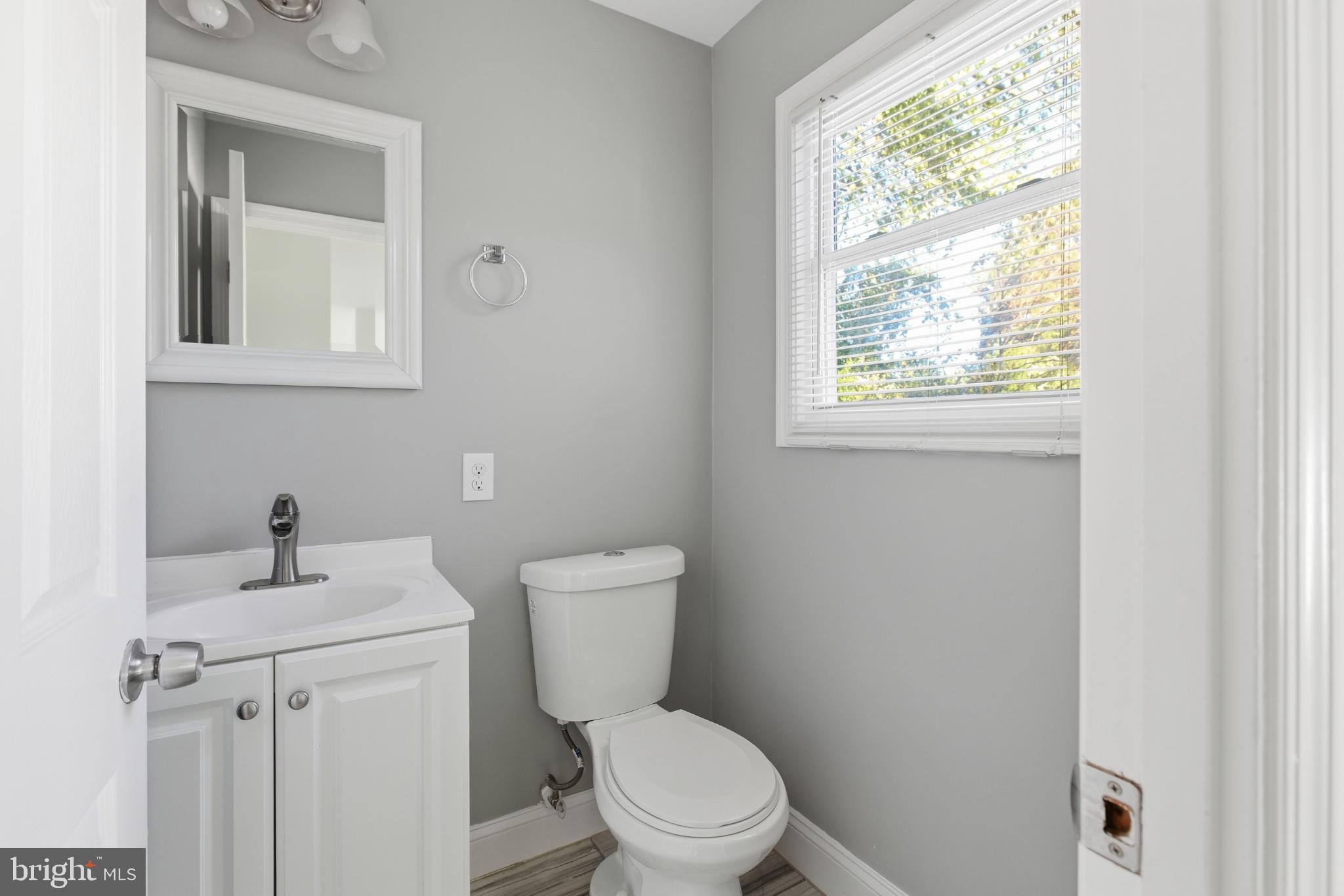 1826 Hanson Road Edgewood, MD 21040 - Photo 8 of 22 a white toilet sitting next to a bathroom sink