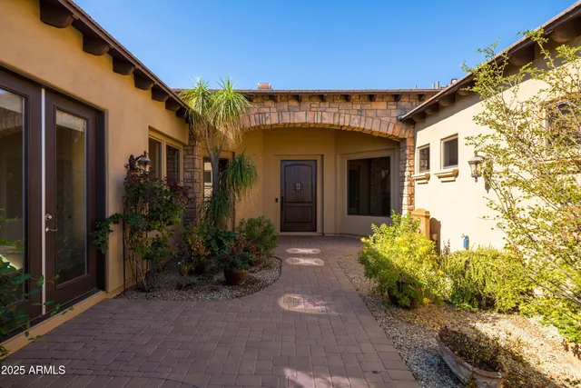 a view of a livingroom with furniture fireplace and a window