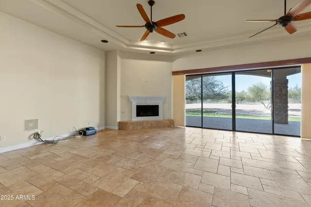 a kitchen with cabinets appliances and a dining table