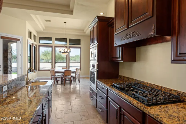 a bath tub sitting in a bathroom next to a window