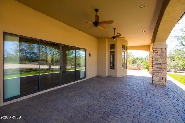a view of a backyard of the house