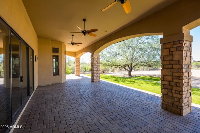 a view of a house with large outdoor space