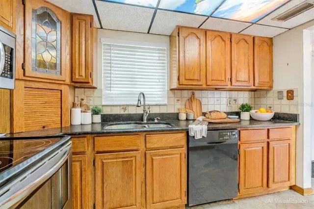 a kitchen with granite countertop a sink and cabinets