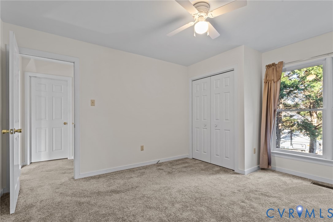 518 Rebel Ridge Road Colonial Heights, VA 23834 - Photo 20 of 44 a view of an empty room with window chandelier fan