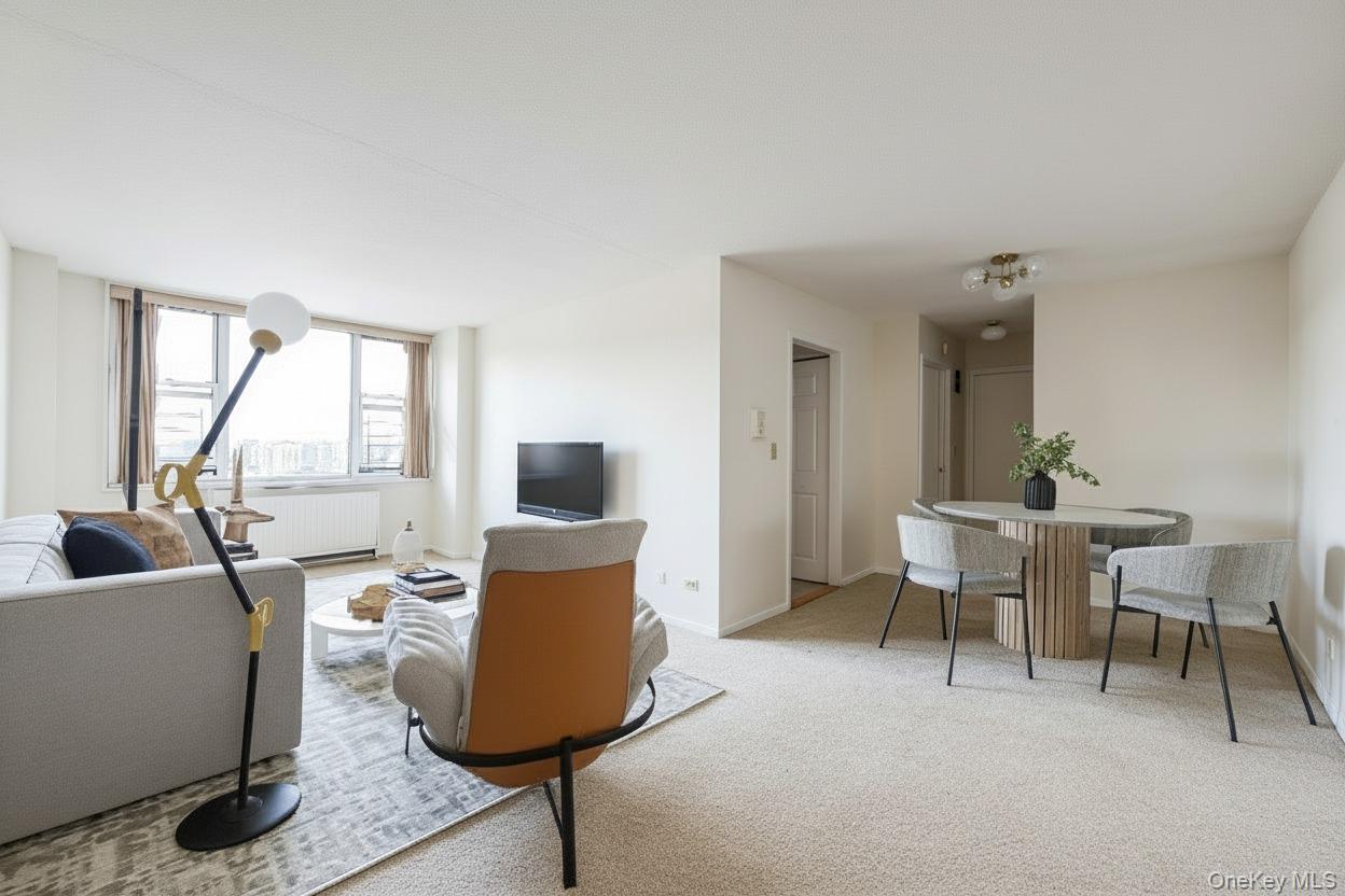 Living room with light carpet and baseboards