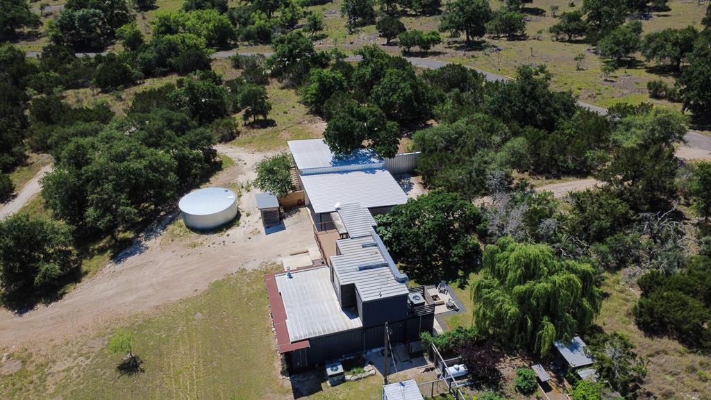 228-232 Spring Road Fredericksburg, TX 78624 - Photo 2 of 57 an aerial view of a house with a yard
