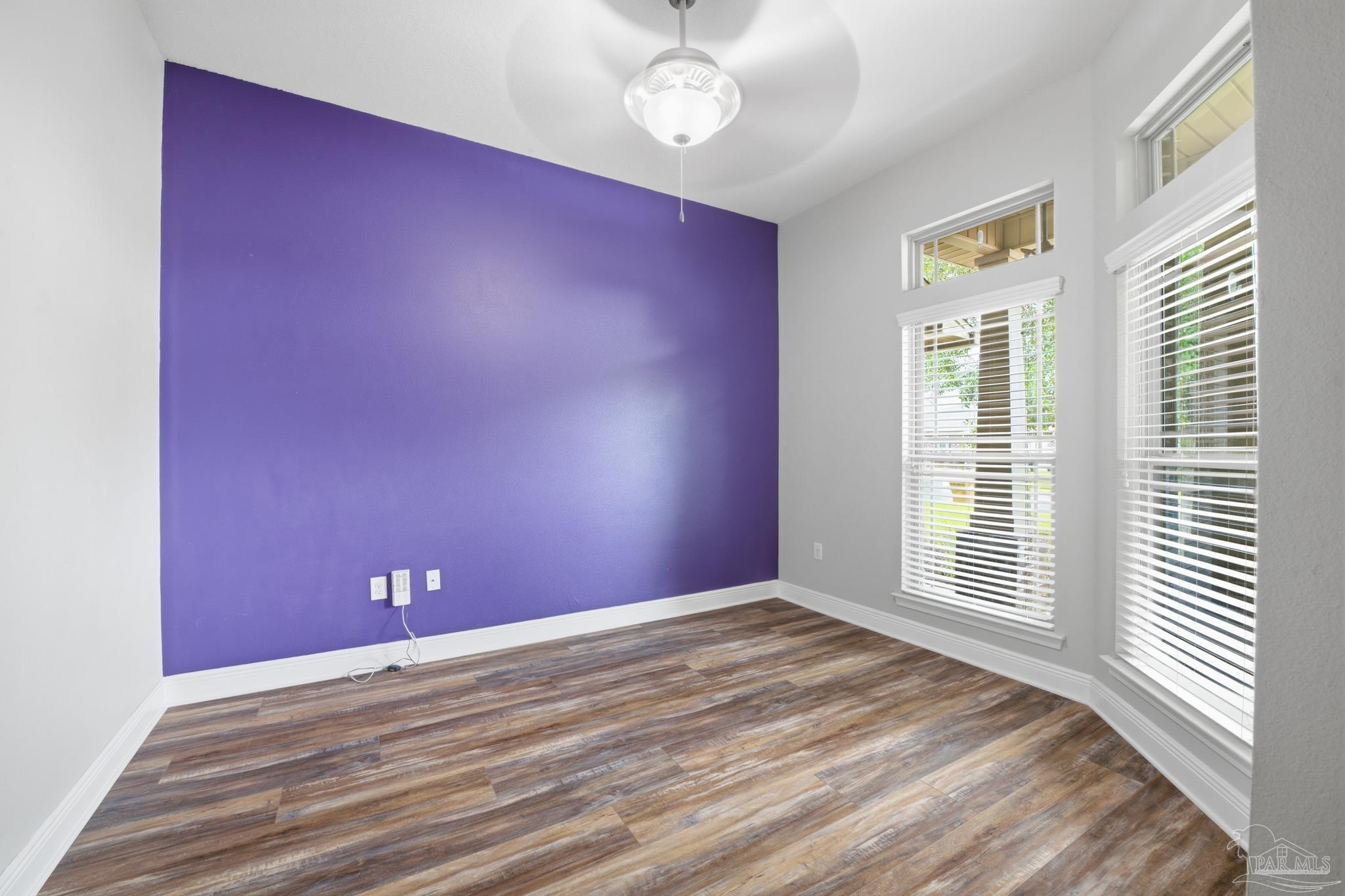 5661 Cane Syrup Circle Pace, FL 32571 - Photo 4 of 20 a view of empty room with wooden floor and fan