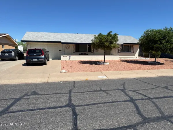 a view of car parked in front of house