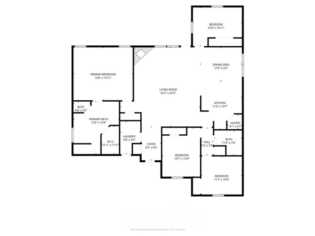 a bedroom with a bed and a flat tv screen on a dresser