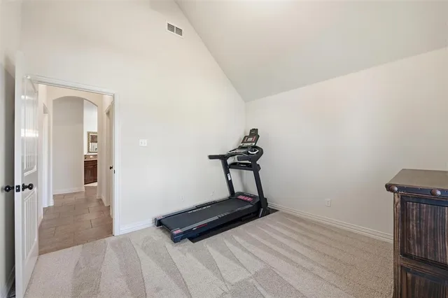 a room with a bed and a window