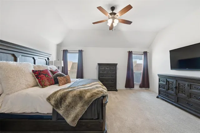 a bathroom with a granite countertop sink a mirror and a shower