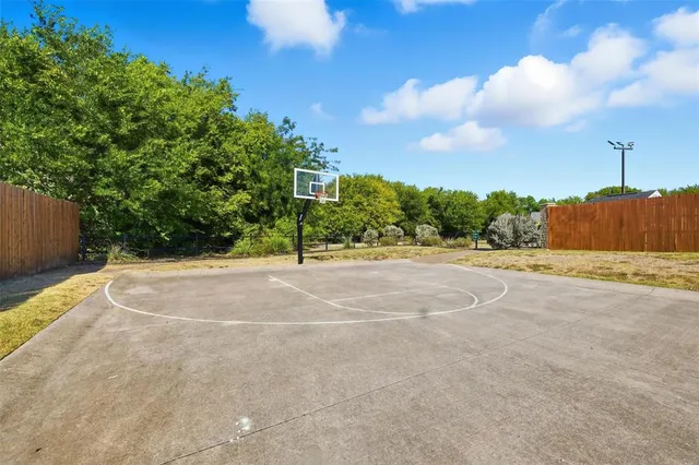 a view of a swimming pool with a yard