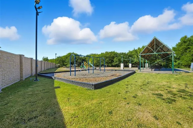 a view of a swimming pool with a lounge chair