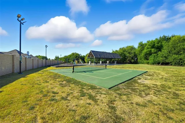 a view of multiple houses with a yard