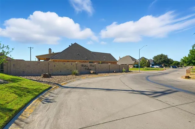 a view of an outdoor space and tennis court