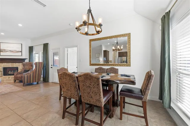 a dining room with furniture a livingroom and chandelier