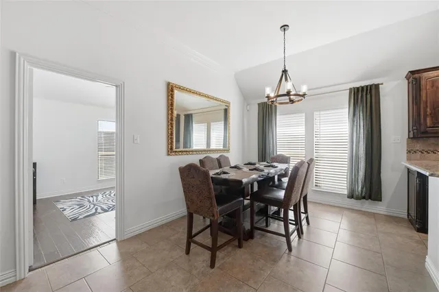a view of a dining room with furniture and window