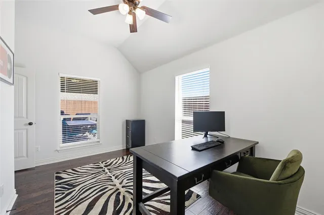 a workspace with furniture and a window